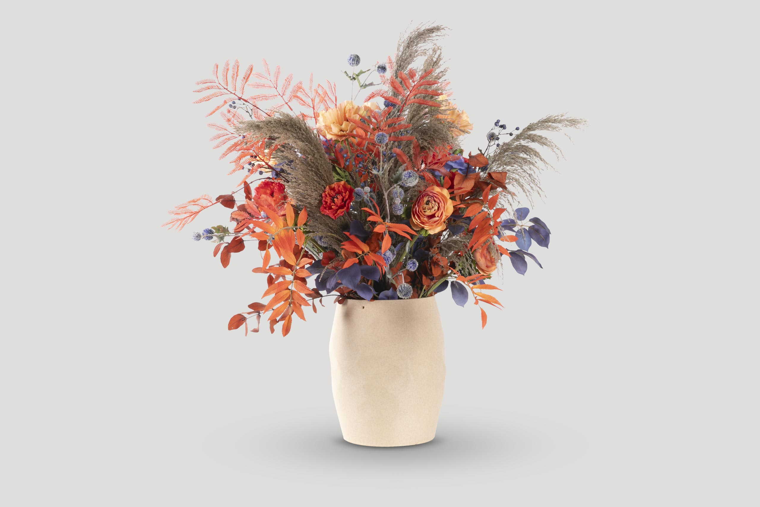 Autumn Floral Arrangement in a Beige Vase