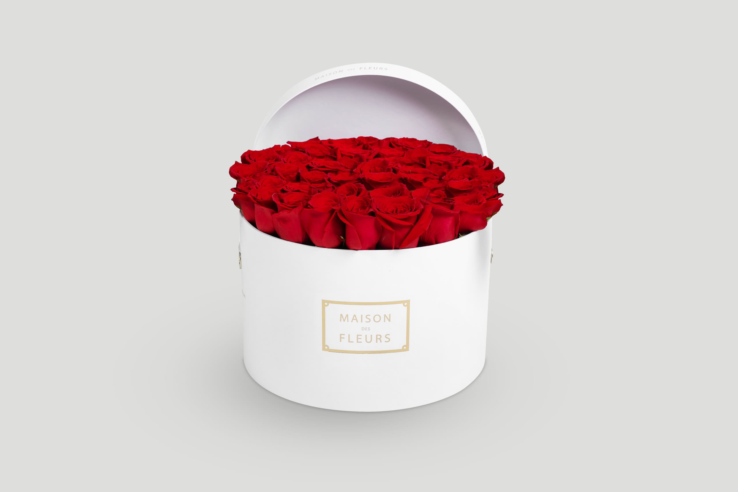White Round Box Filled with Red Roses