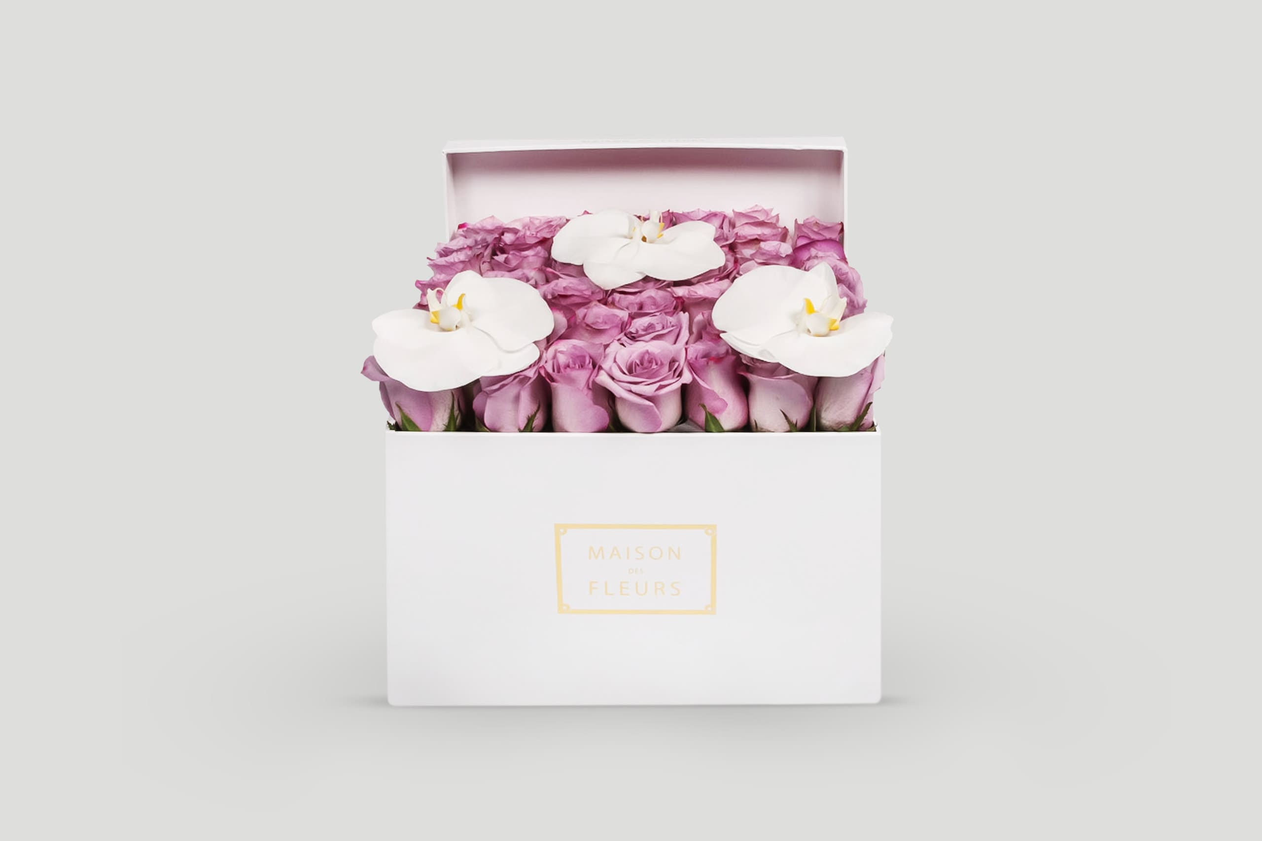Fresh Roses and Orchids in a Square Box