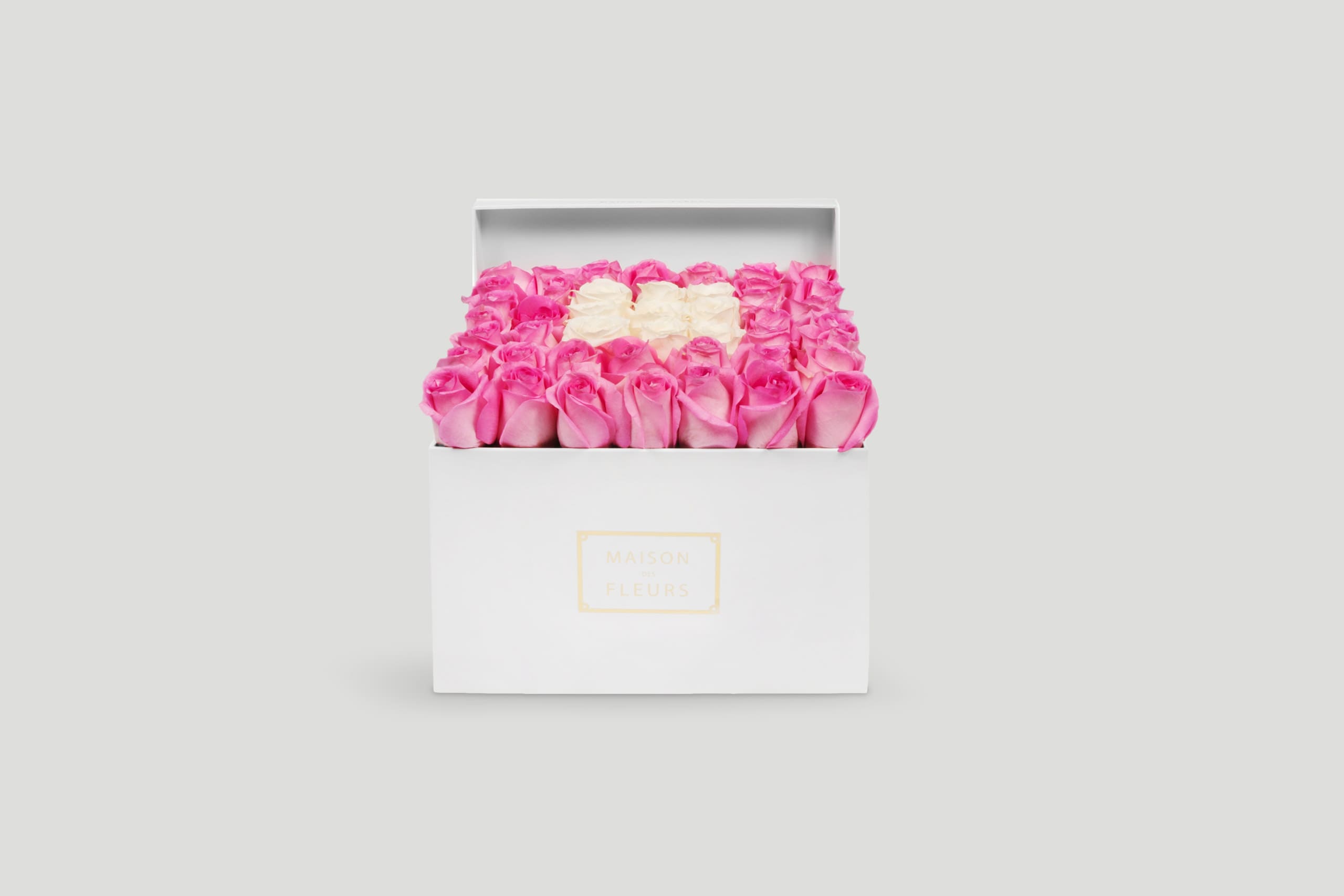 Pink and White Roses Arranged Neatly in a White Square Box
