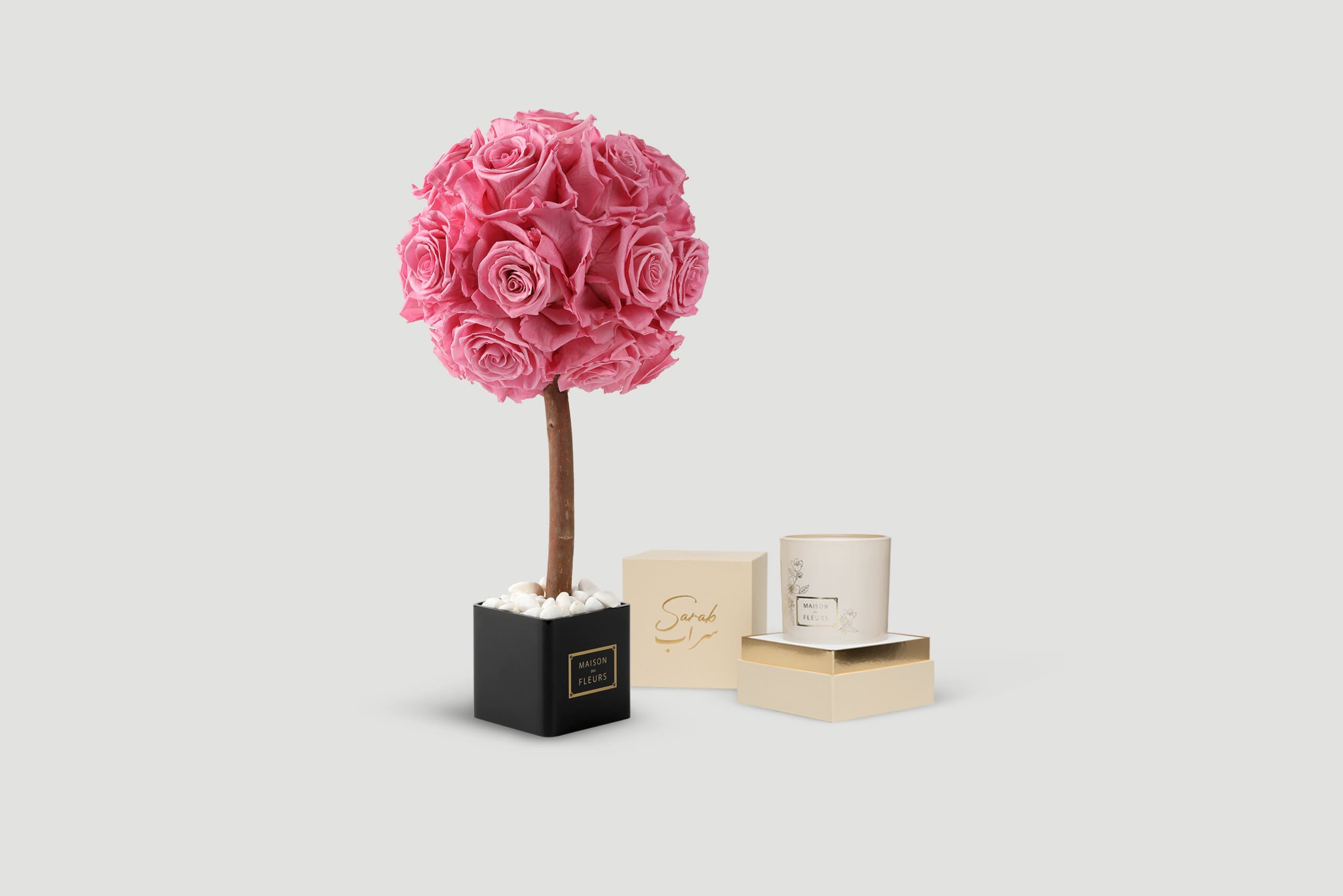 Pink rose topiary with gift boxes